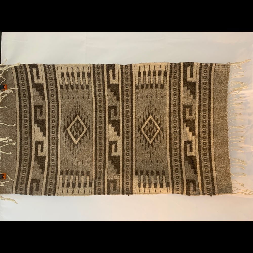 Medium size wool rug handcrafted